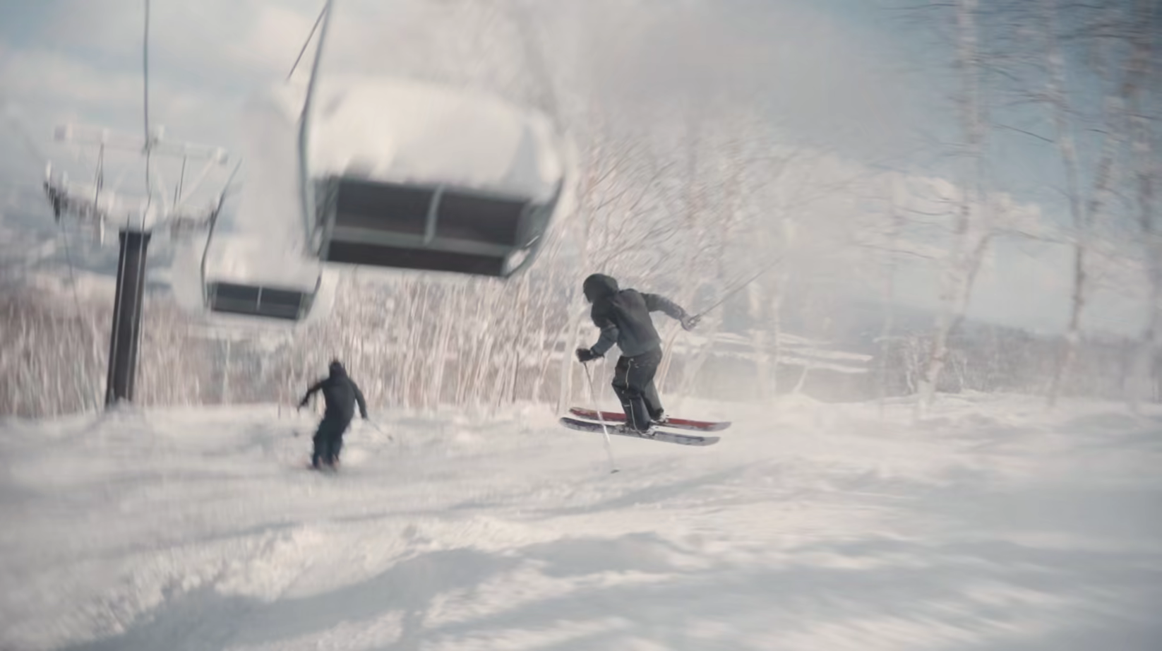 Skiers riding out under a snow-loaded chairlift