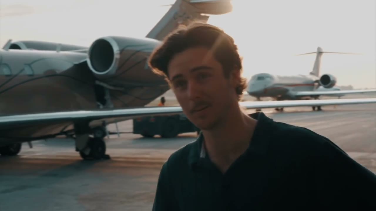 On an airport apron at golden hour, jets parked behind, a CCX best clip