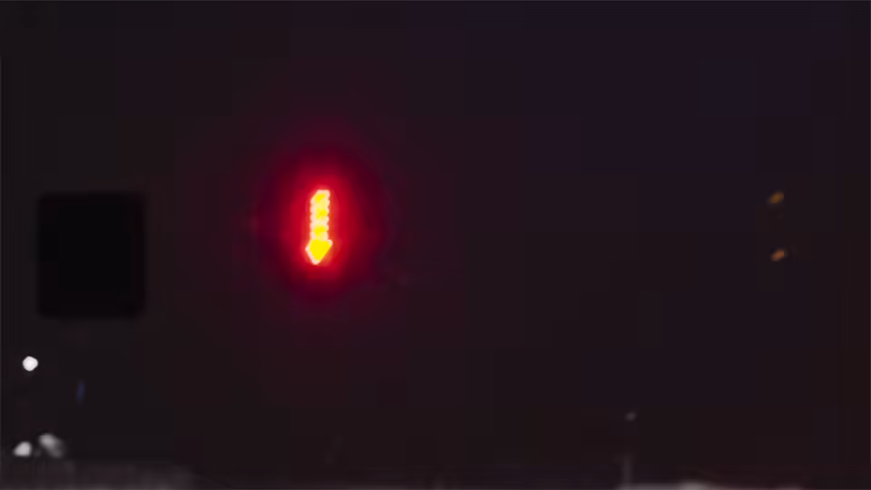 Snow road at night, headlights approaching